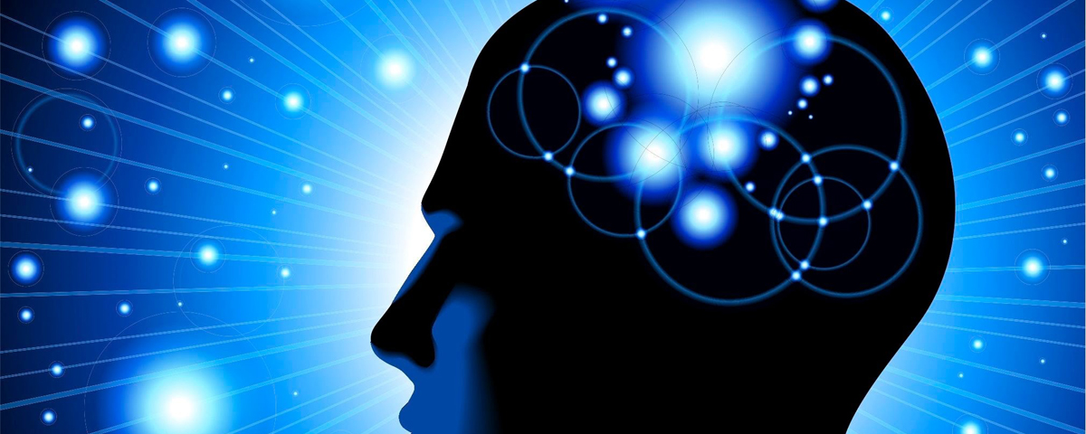 Silhouette of a head lit with points of light representing mental activity